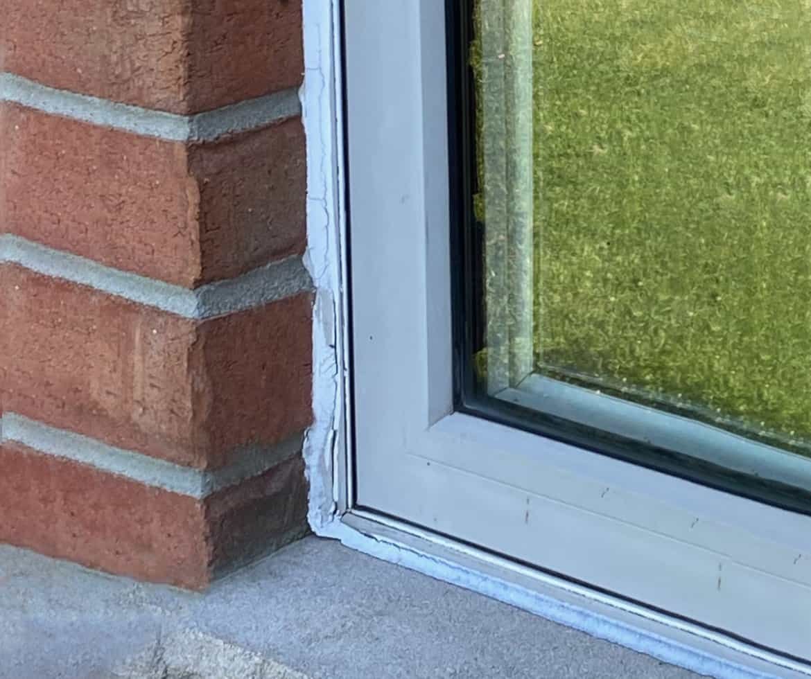 CaulkingGuyWindowbeforeCaulking
